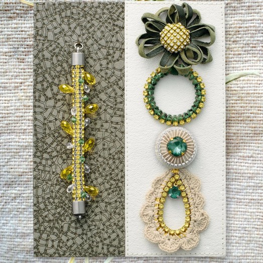жилки листа, образует фон для полосы из Swarovski Re Created Dark Jonquil Mesh, украшенной подвесками и бусинами, напоминающими извивающиеся лозы